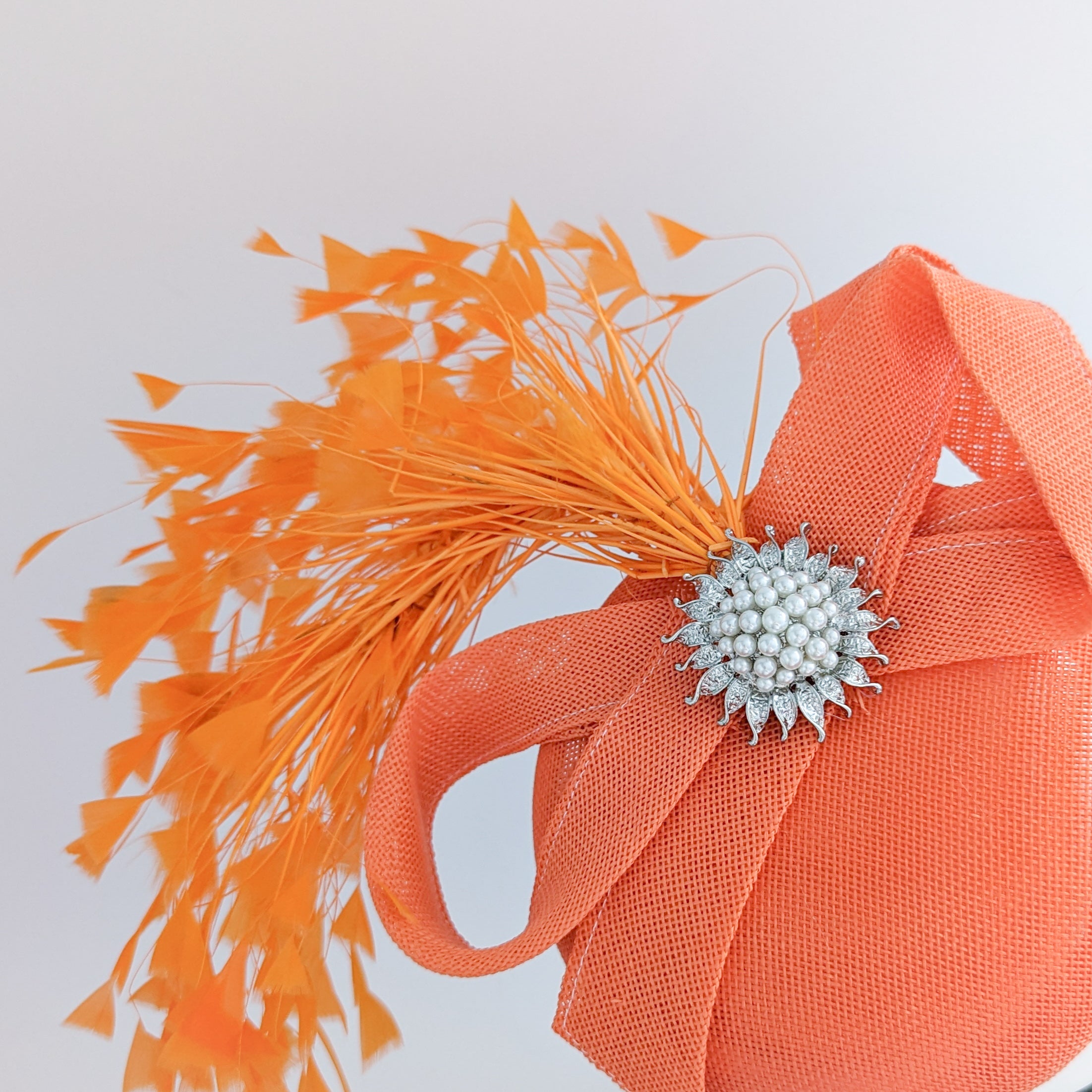 Coral orange feather pearl fascinator hat