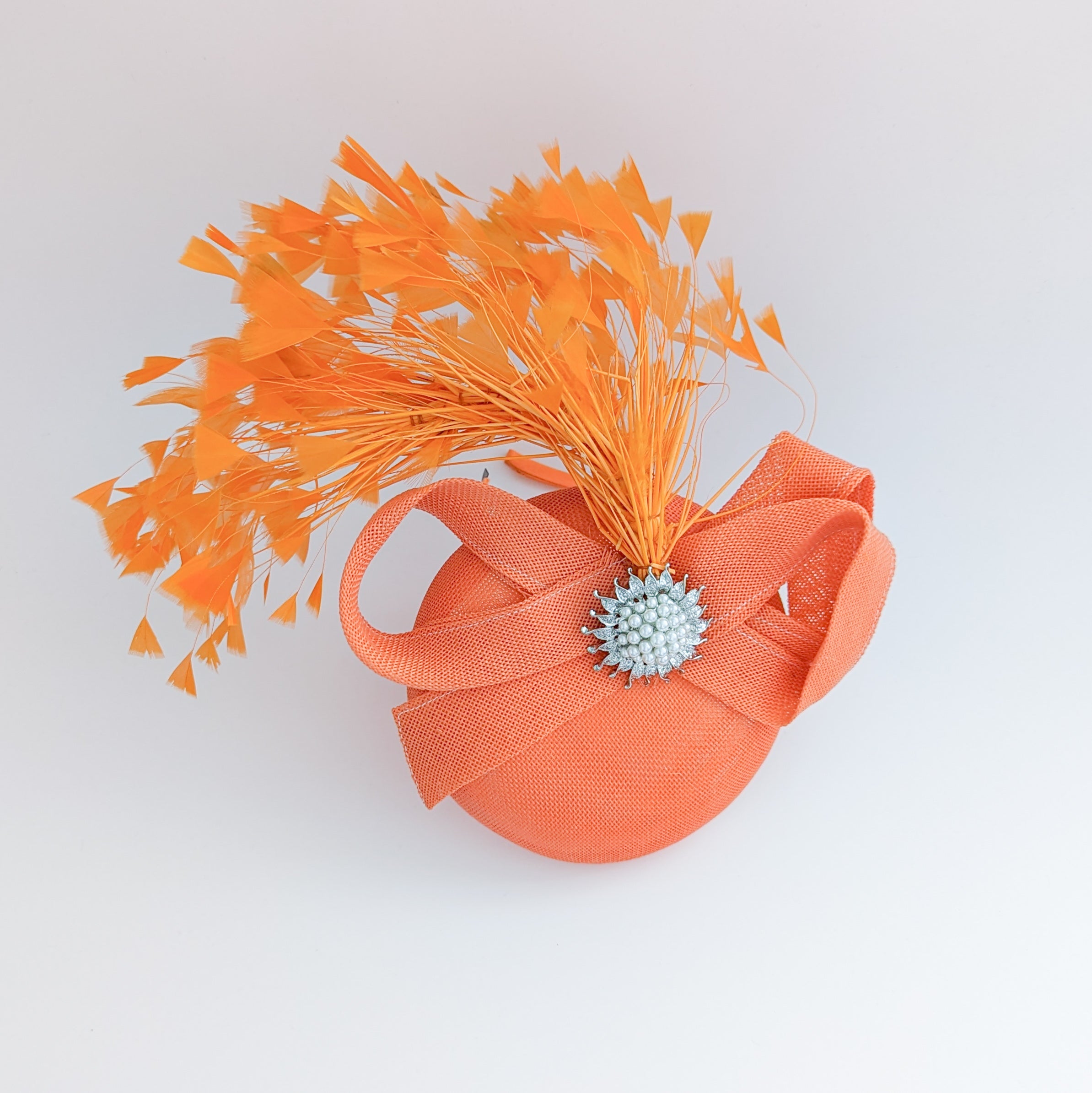 Coral orange feather pearl fascinator hat Coral orange feather pearl fascinator hat