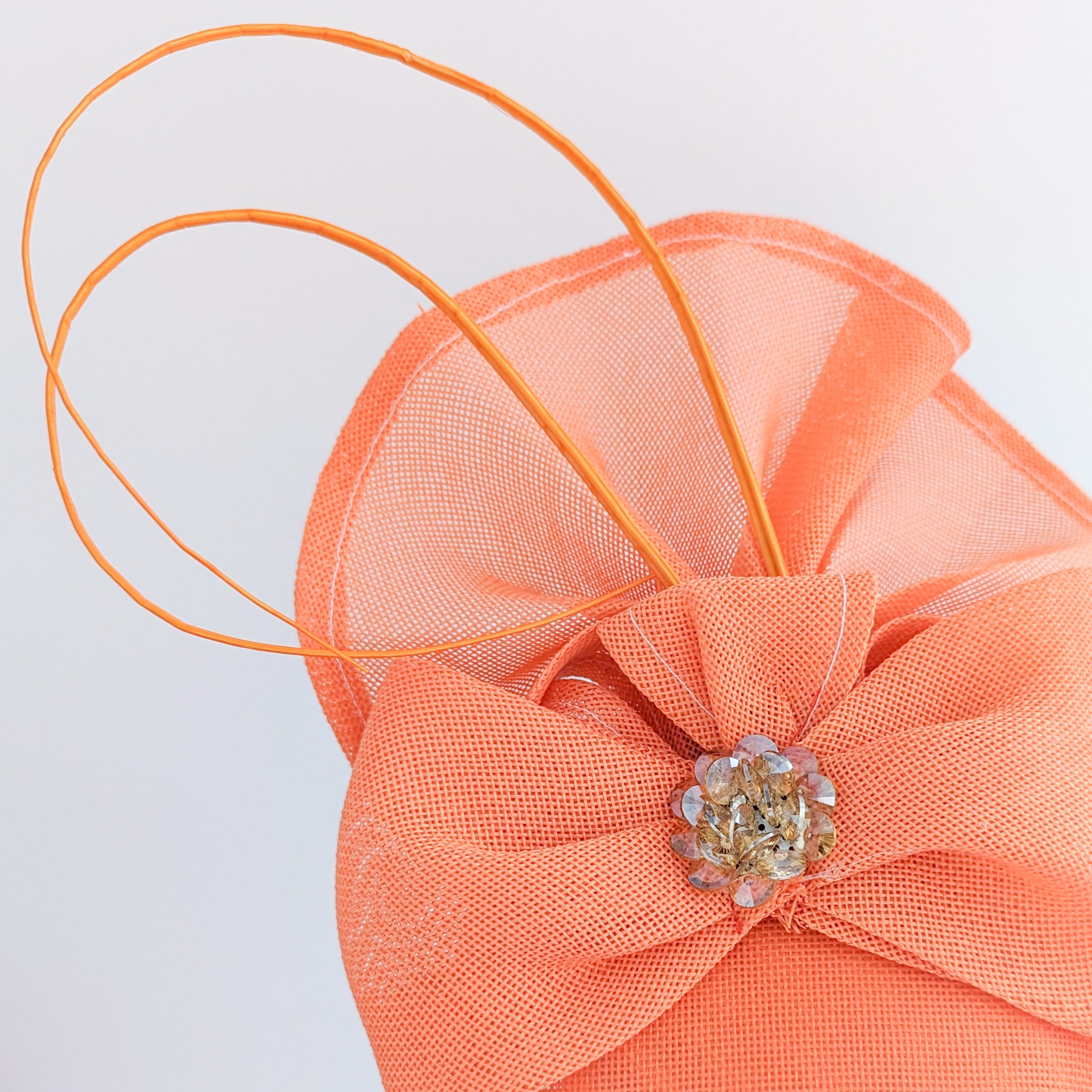 Coral orange crystal bow fascinator hat Coral orange crystal bow fascinator hat