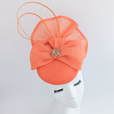 Coral orange crystal bow fascinator hat Coral orange crystal bow fascinator hat