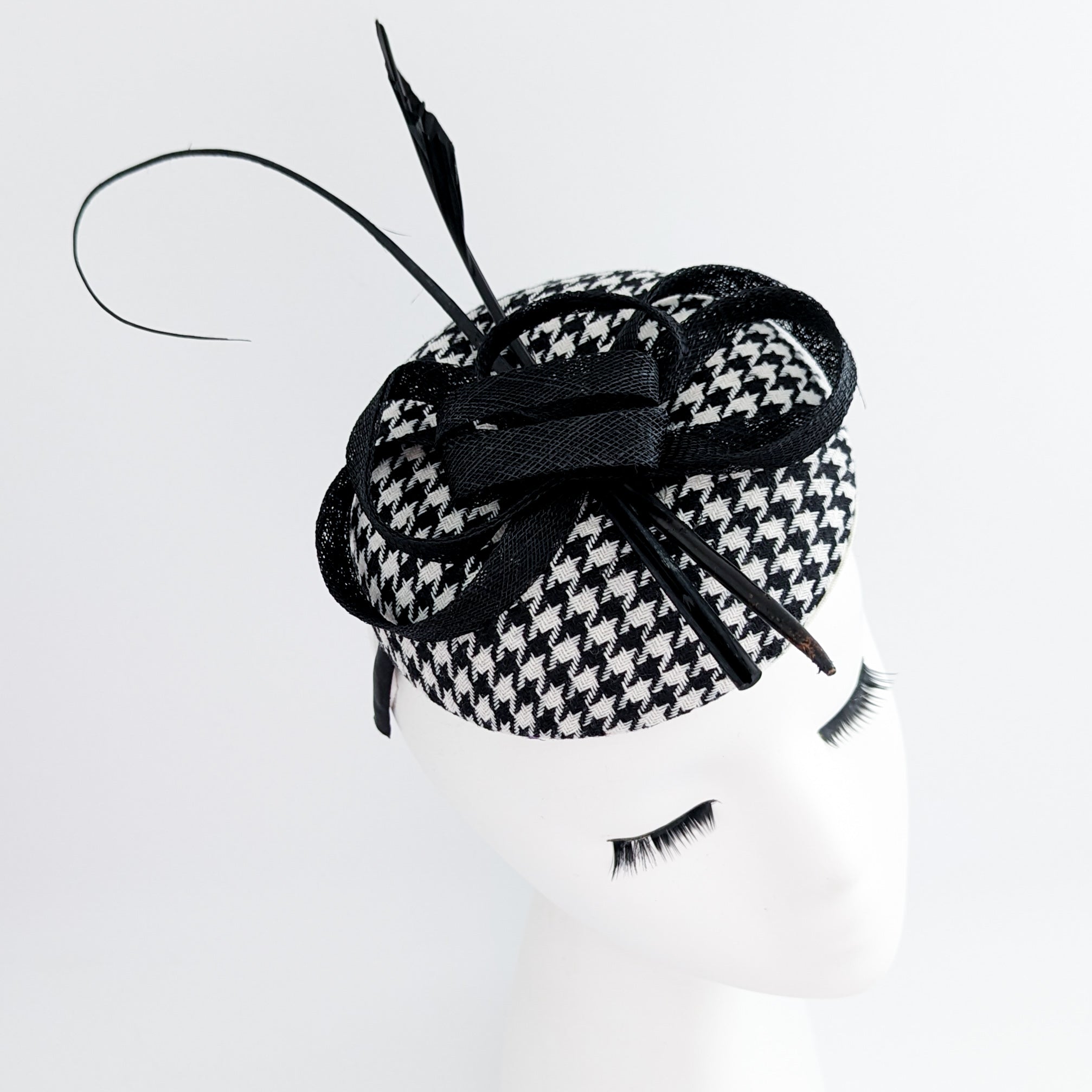 Black and white houndstooth feather fascinator hat