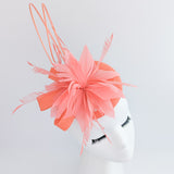 Coral orange feather fascinator hat Coral orange feather fascinator hat