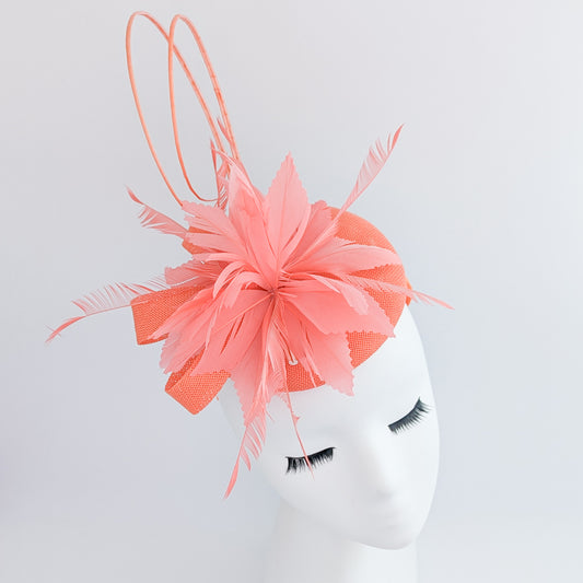 Coral orange feather fascinator hat