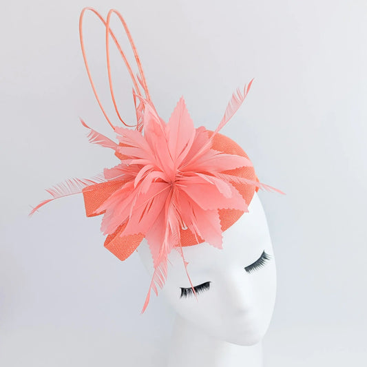 Coral orange feather fascinator hat House of Hats