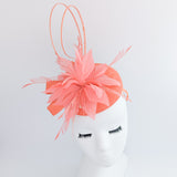 Coral orange feather fascinator hat Coral orange feather fascinator hat