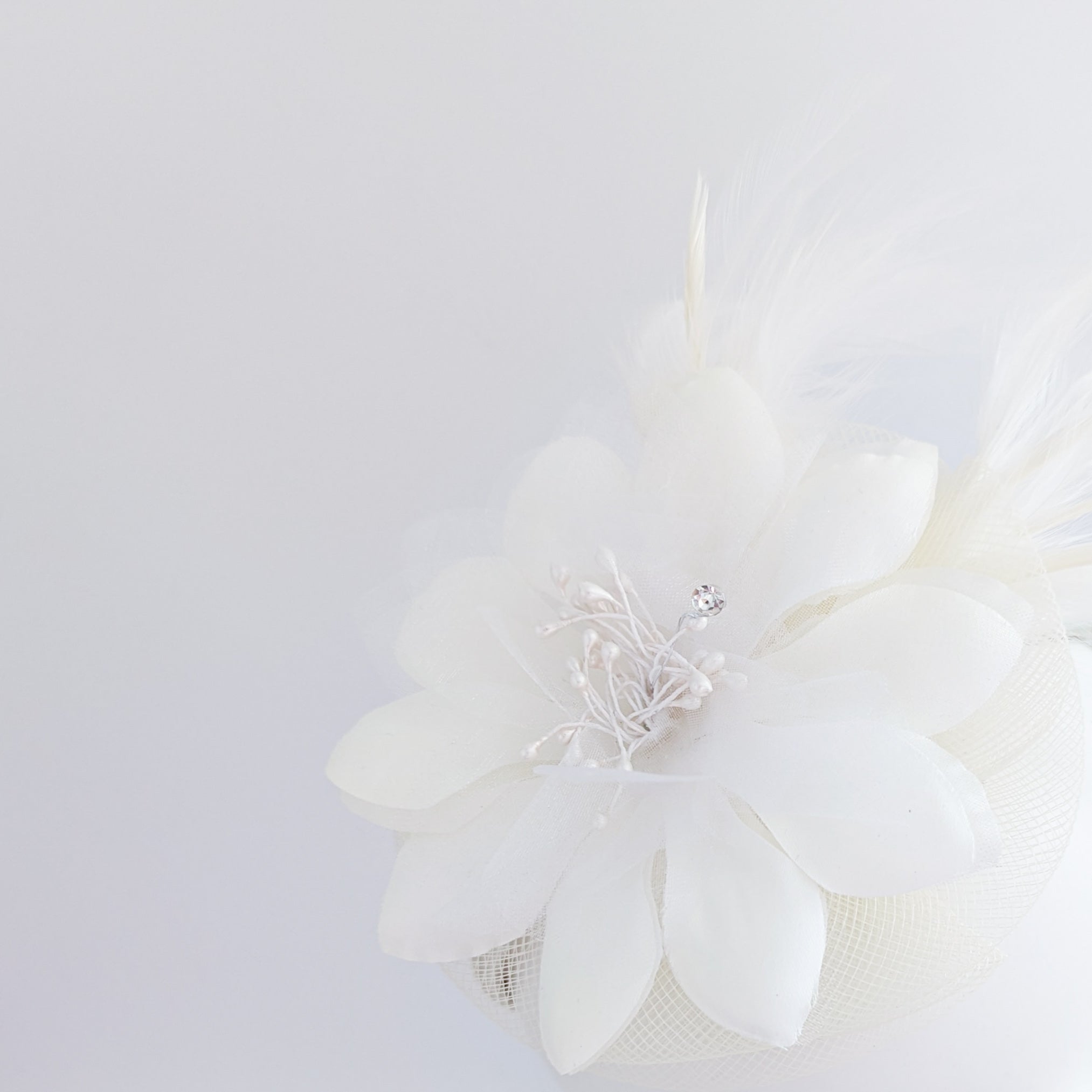 Cream feather flower fascinator hat Cream feather flower fascinator hat
