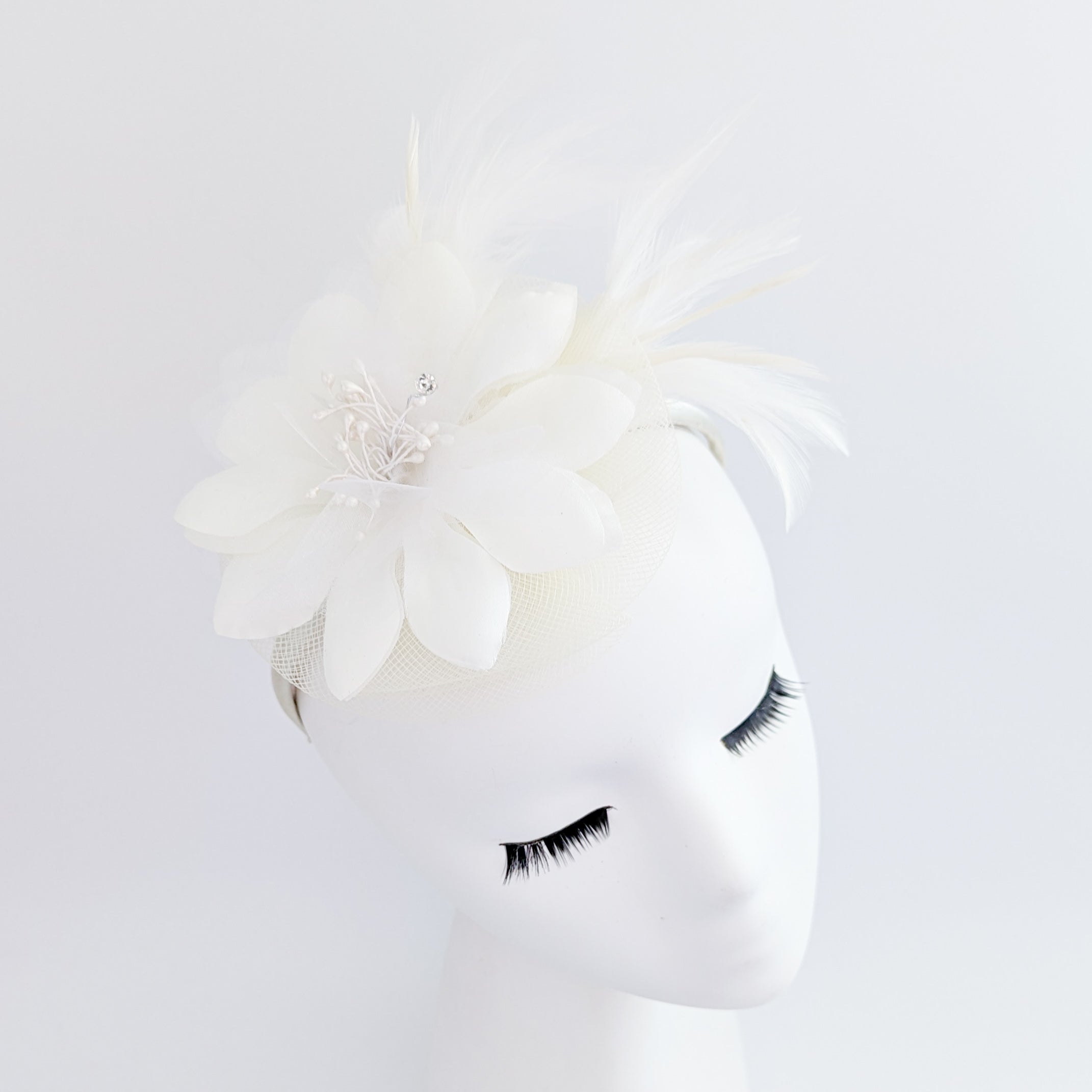 Cream feather flower fascinator hat Cream feather flower fascinator hat