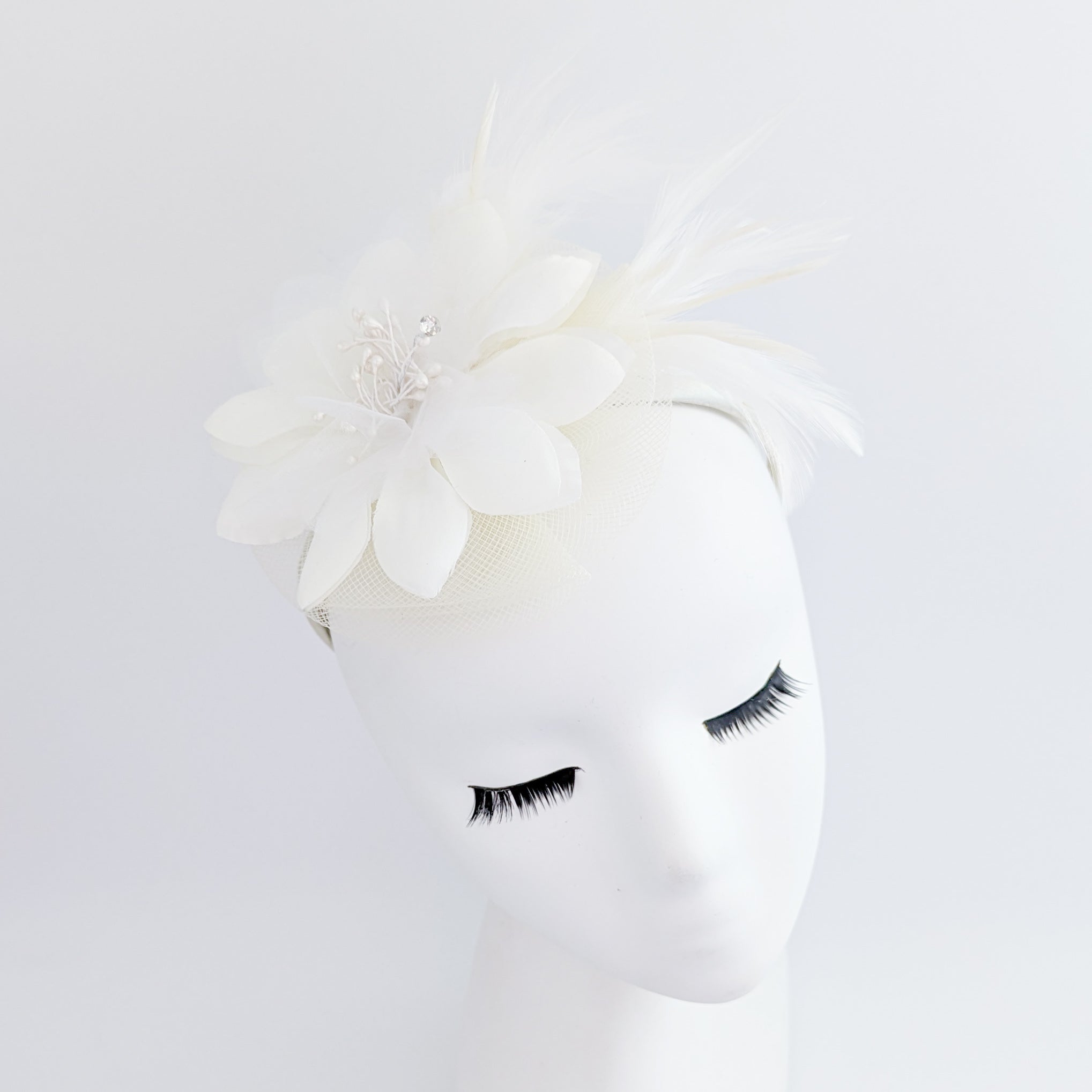 Cream feather flower fascinator hat Cream feather flower fascinator hat