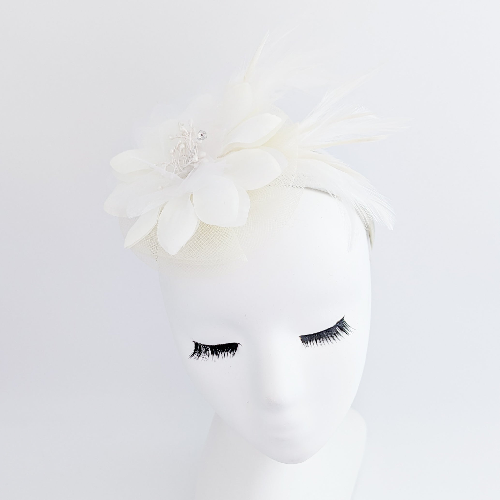 Cream feather flower fascinator hat Cream feather flower fascinator hat