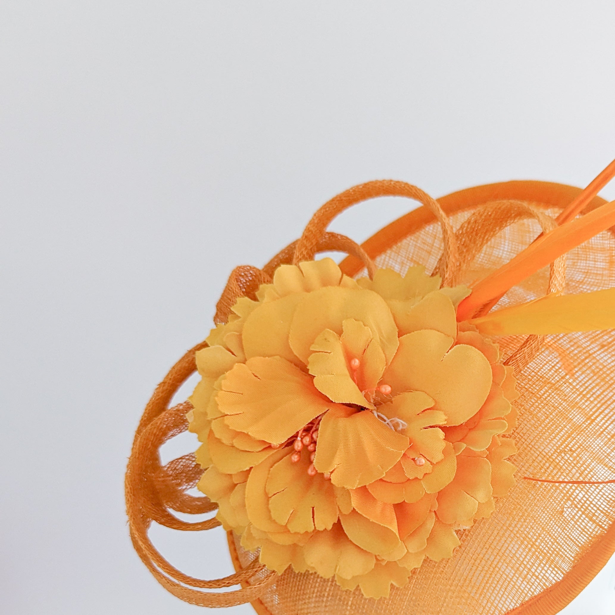 Orange flower fascinator disc saucer hat Orange flower fascinator disc saucer hat