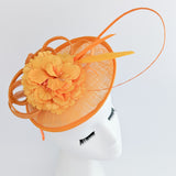 Orange flower fascinator disc saucer hat Orange flower fascinator disc saucer hat