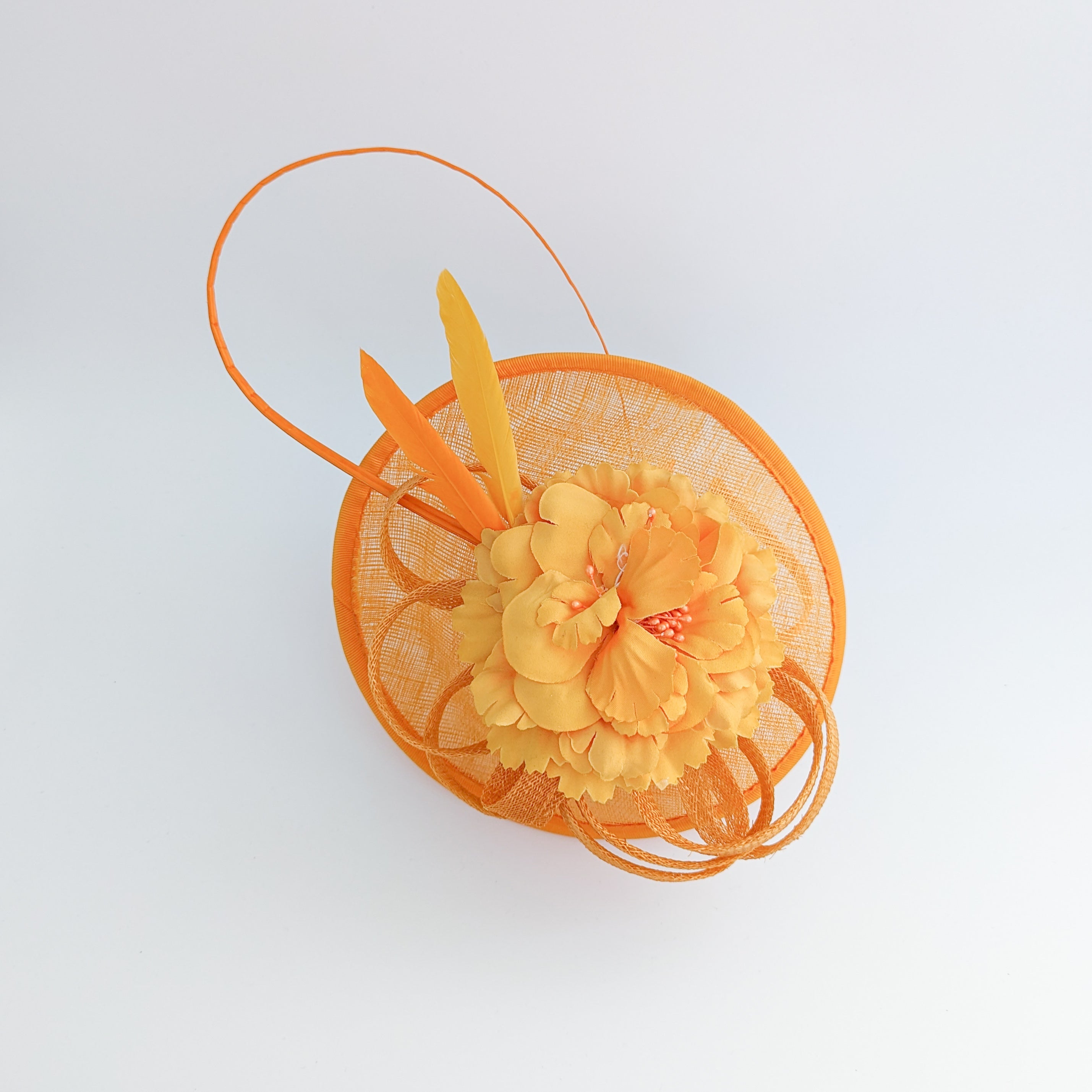 Orange flower fascinator disc saucer hat Orange flower fascinator disc saucer hat