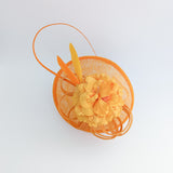 Orange flower fascinator disc saucer hat Orange flower fascinator disc saucer hat