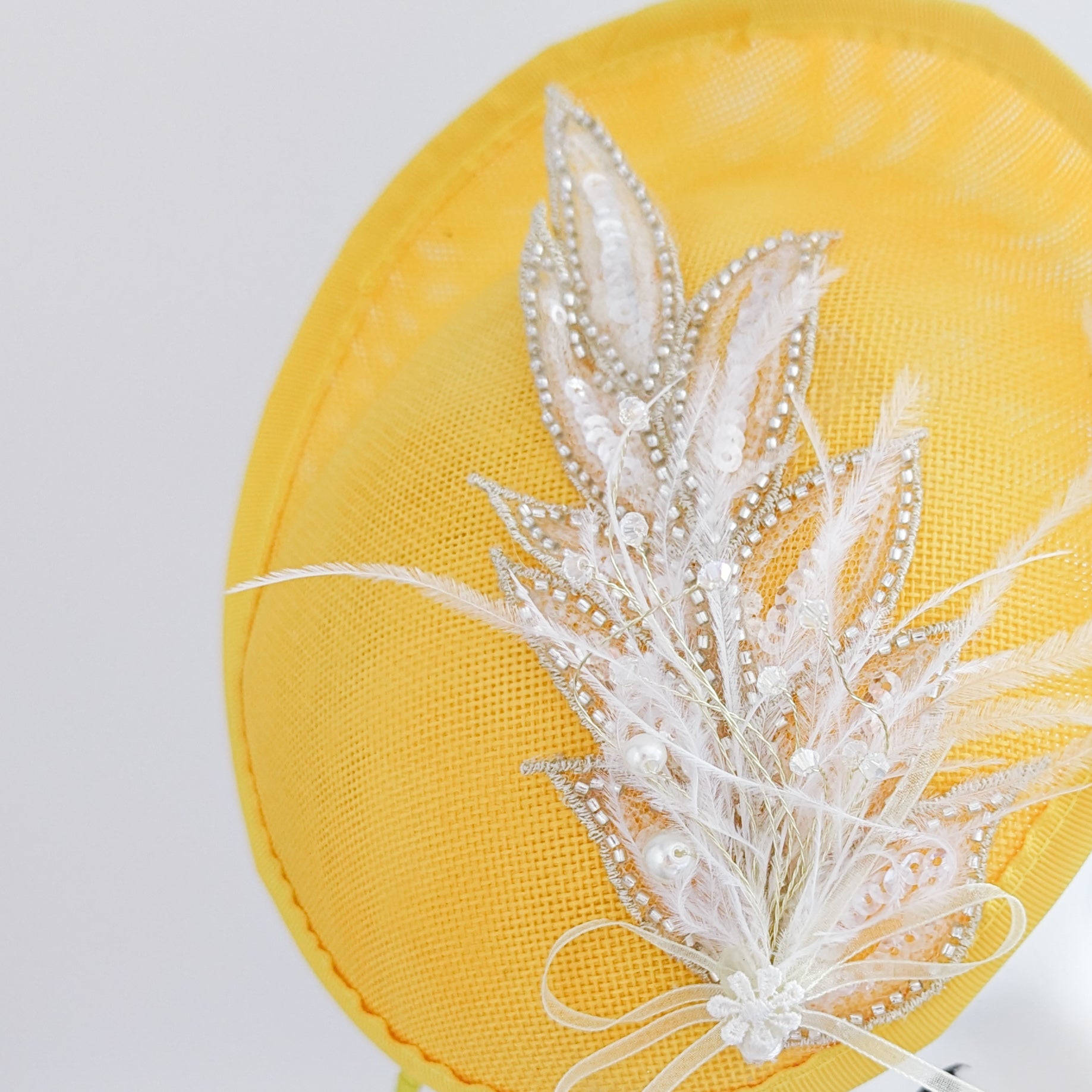 Yellow crystal feather disc saucer fascinator hat