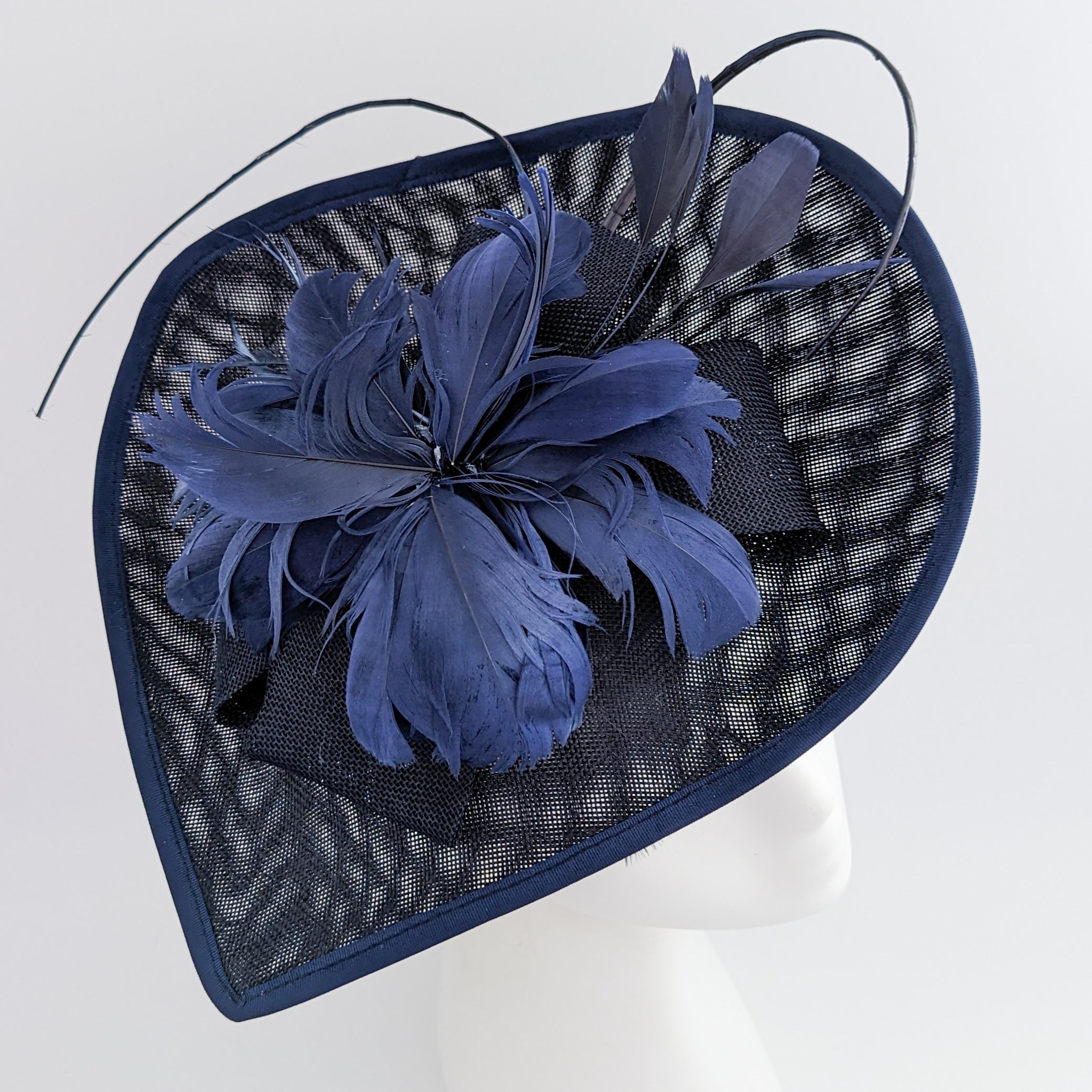 Navy blue large teardrop feather fascinator hat Navy blue large teardrop feather fascinator hat