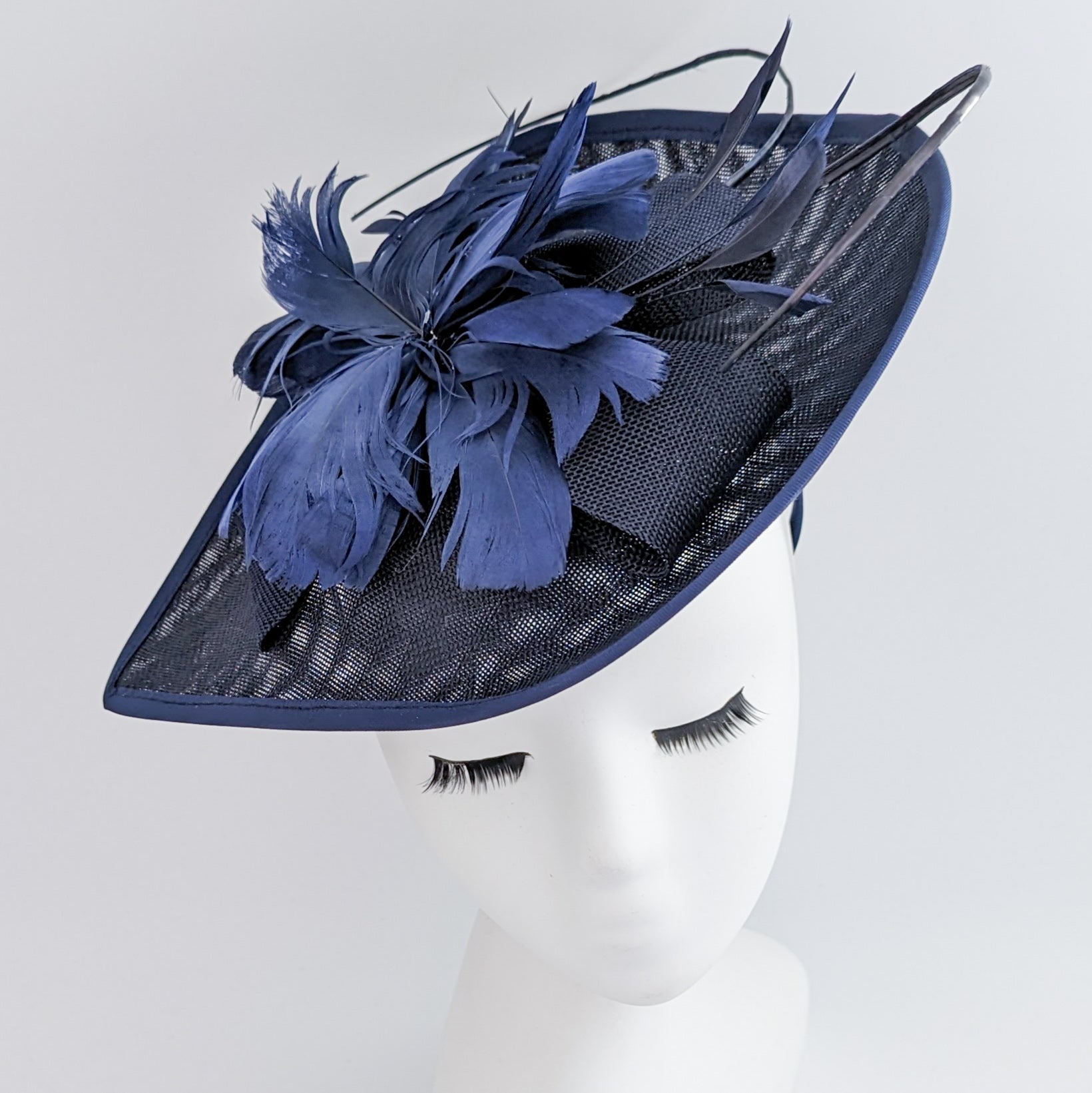 Navy blue large teardrop feather fascinator hat Navy blue large teardrop feather fascinator hat