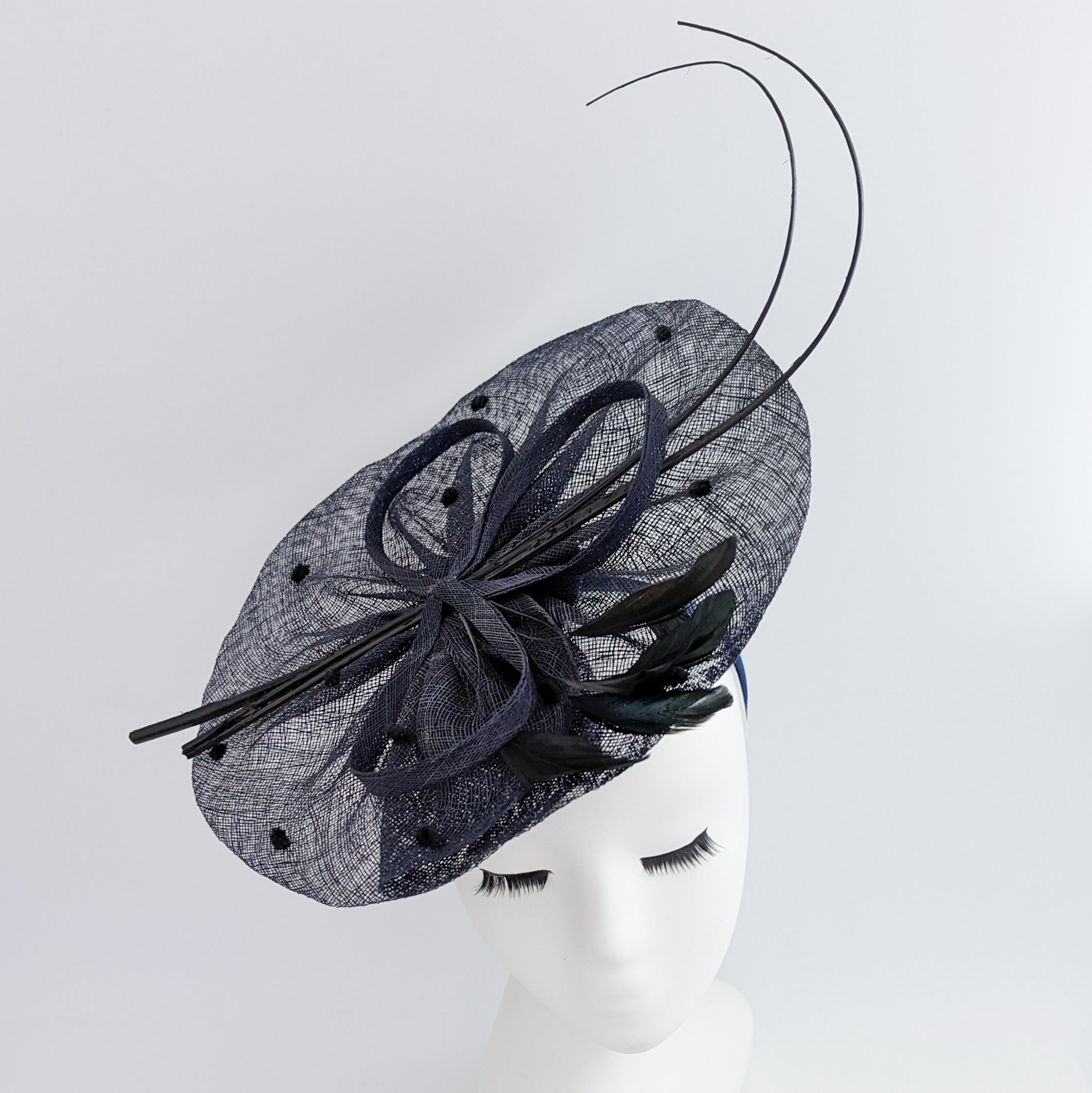 Navy blue large feather polka dot saucer disc fascinator hat Navy blue large feather polka dot saucer disc fascinator hat