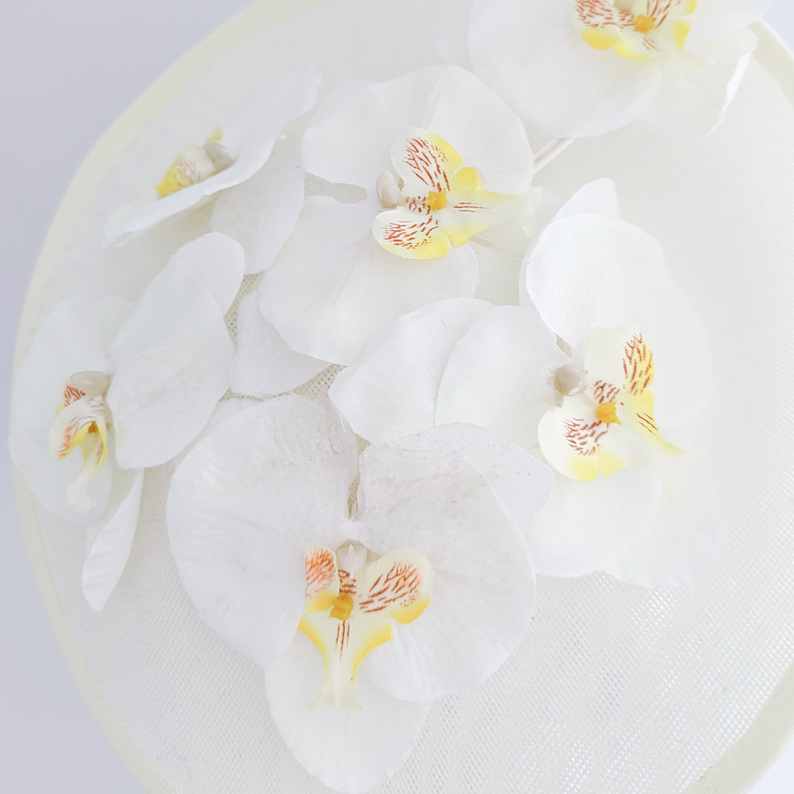 Cream large white orchid flower saucer disc fascinator hat Cream large white orchid flower saucer disc fascinator hat