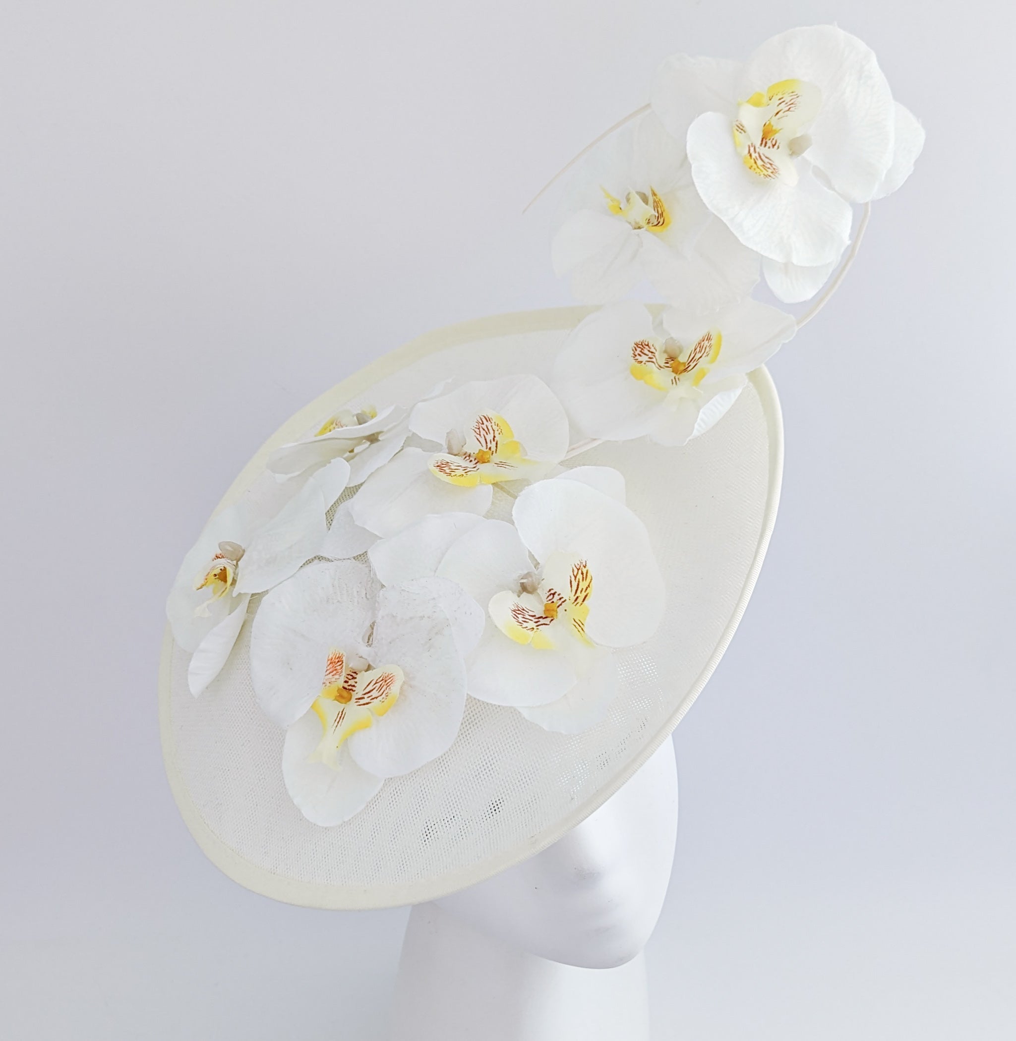 Cream large white orchid flower saucer disc fascinator hat Cream large white orchid flower saucer disc fascinator hat