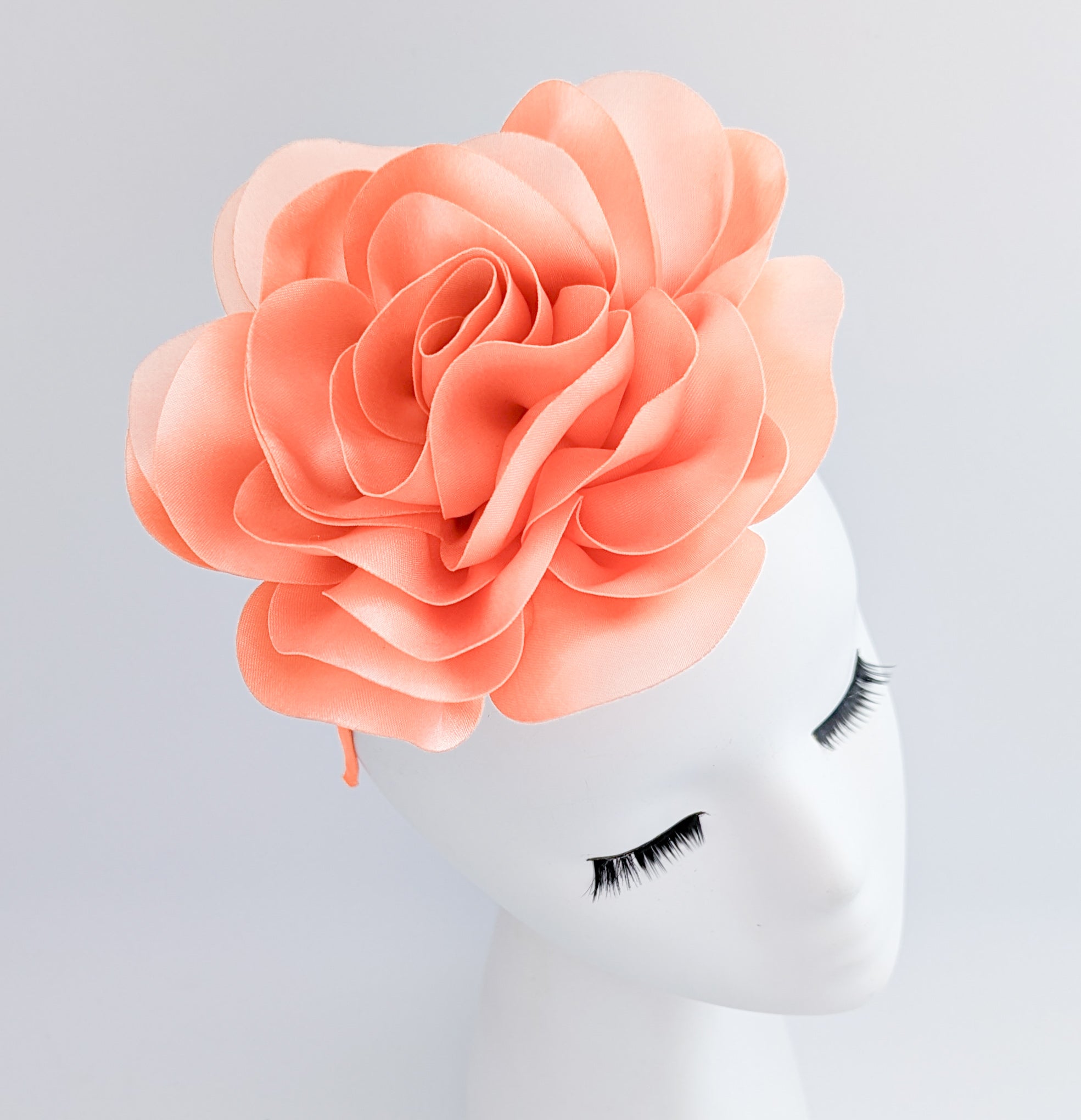 Large peach satin rose fascinator hat Large peach satin rose fascinator hat