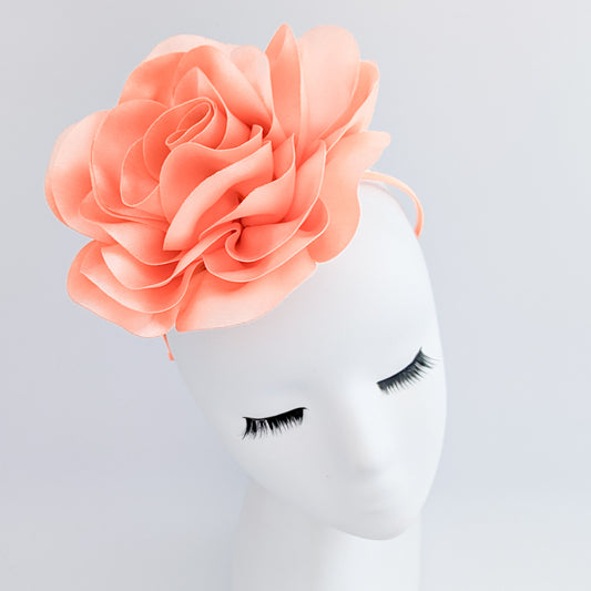 Large peach satin rose fascinator hat