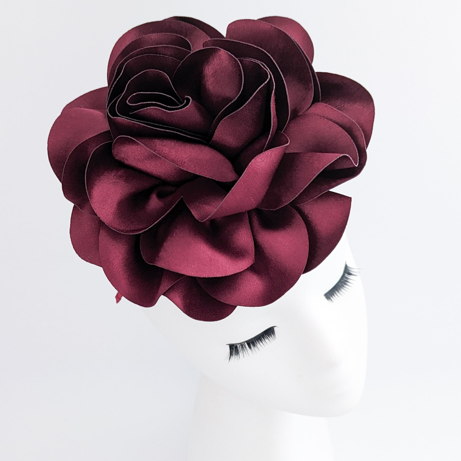 Large burgundy satin rose fascinator hat