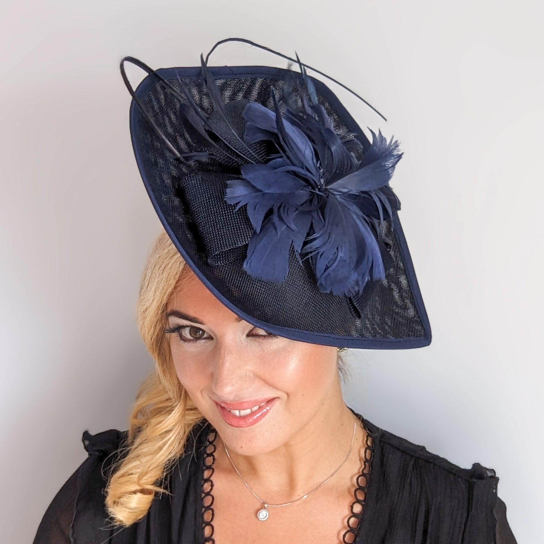 Navy blue large teardrop feather fascinator hat Navy blue large teardrop feather fascinator hat