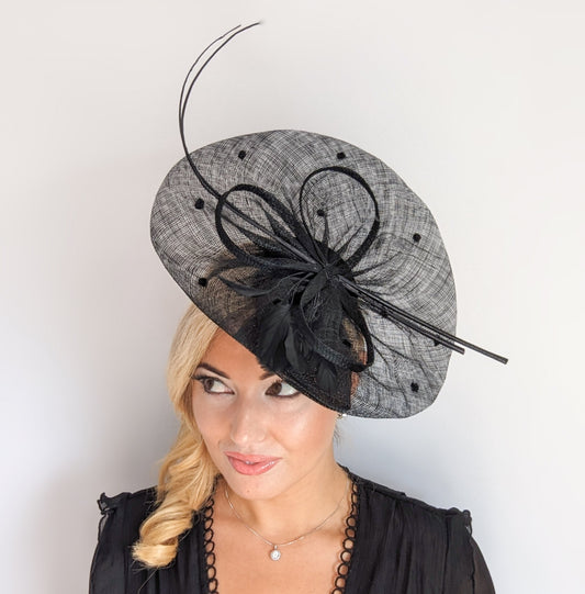 Black large feather polka dot saucer disc fascinator hat