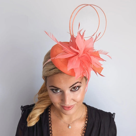 Coral orange feather fascinator hat House of Hats