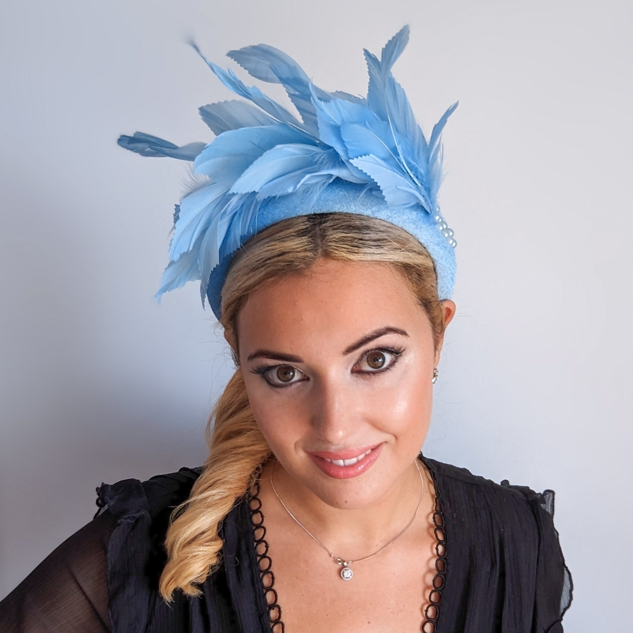 Light cornflower blue feather padded velvet headband fascinator Light cornflower blue feather padded velvet headband fascinator