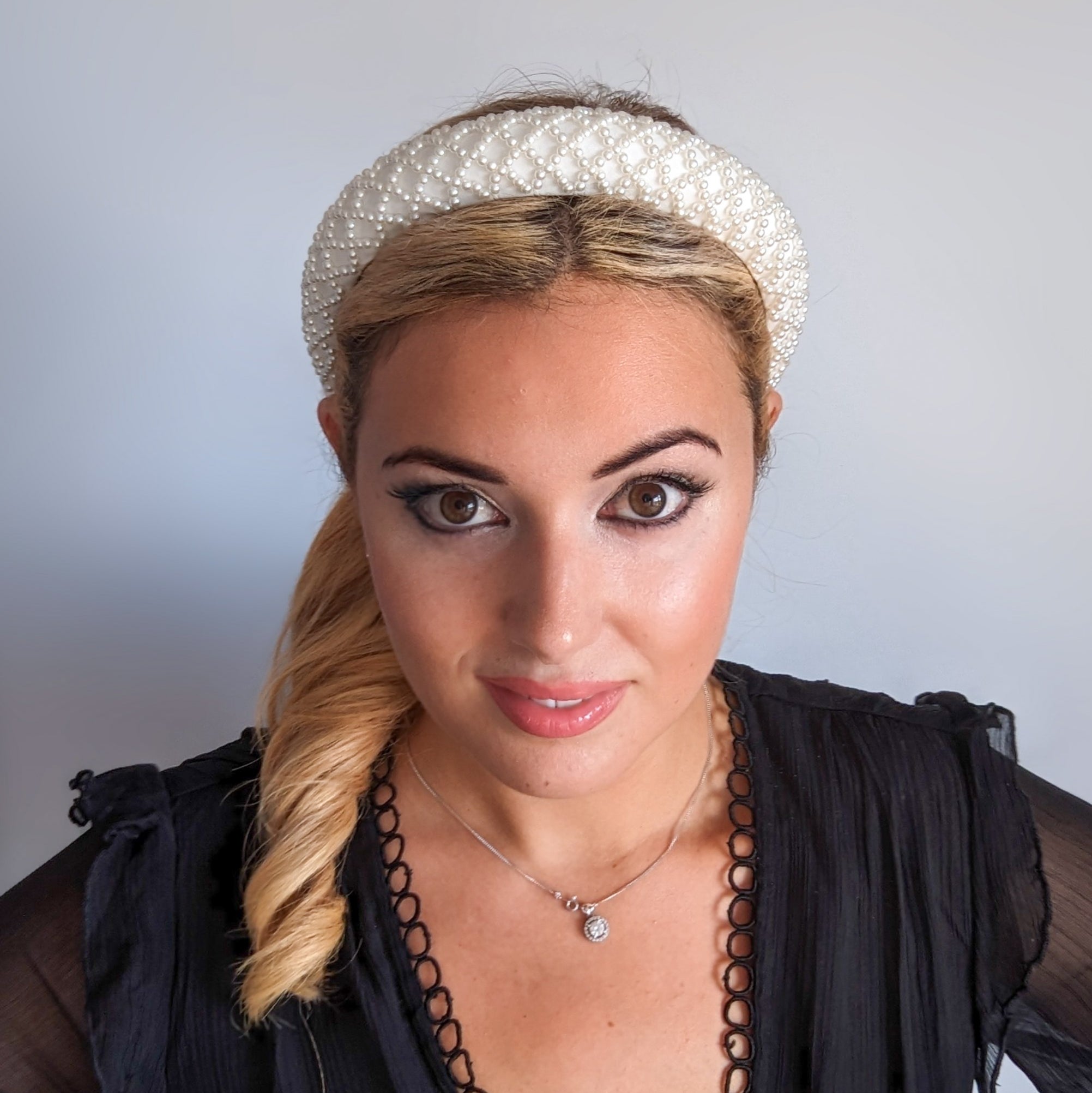 White beaded pearl padded headband fascinator White beaded pearl padded headband fascinator
