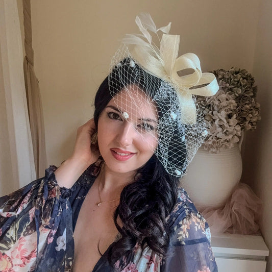 Cream feather fascinator hat House of Hats
