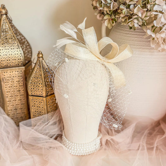 Cream feather fascinator hat House of Hats