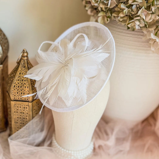 White saucer fascinator hat with feathers House of Hats