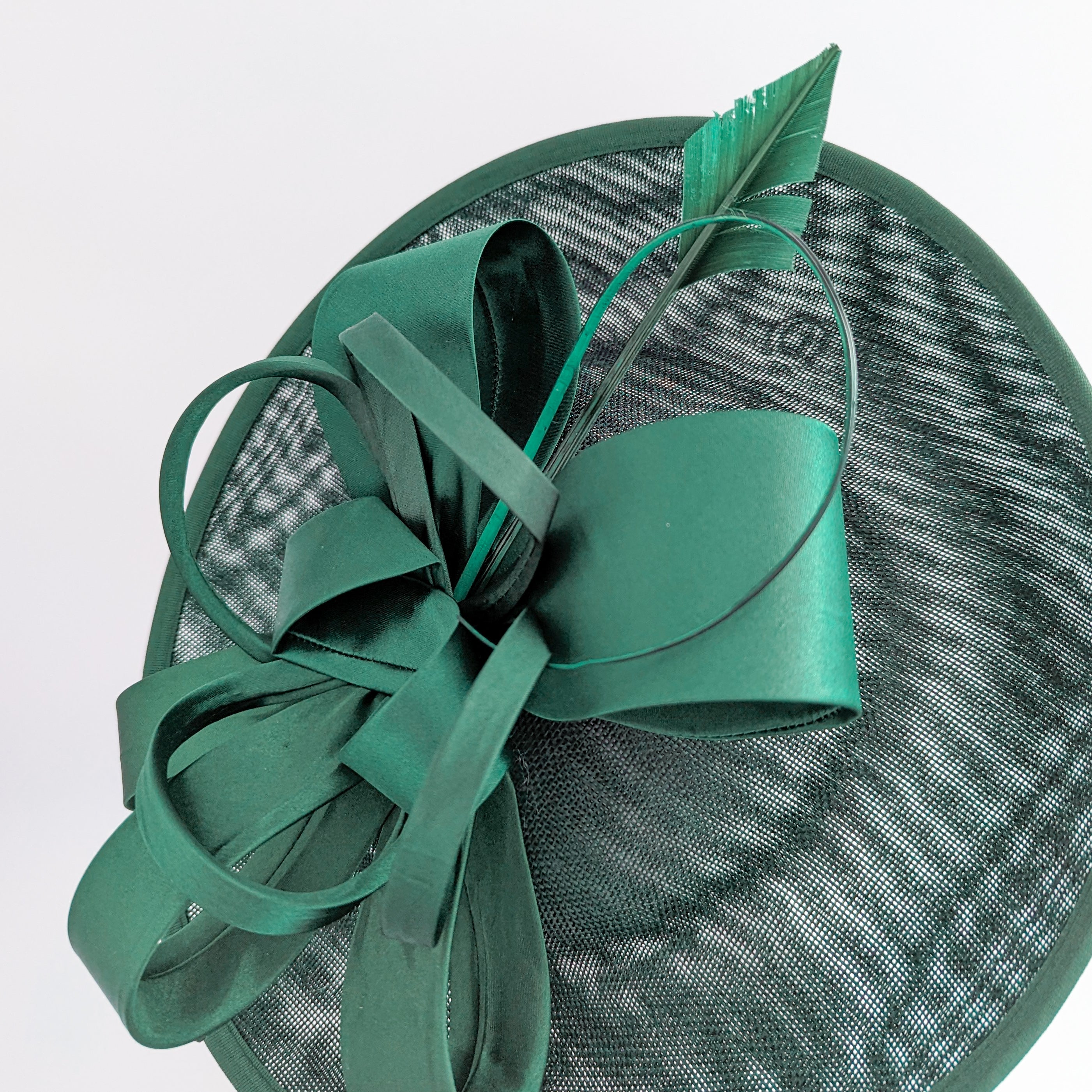Dark emerald green feather large saucer disc fascinator hat Dark emerald green feather large saucer disc fascinator hat