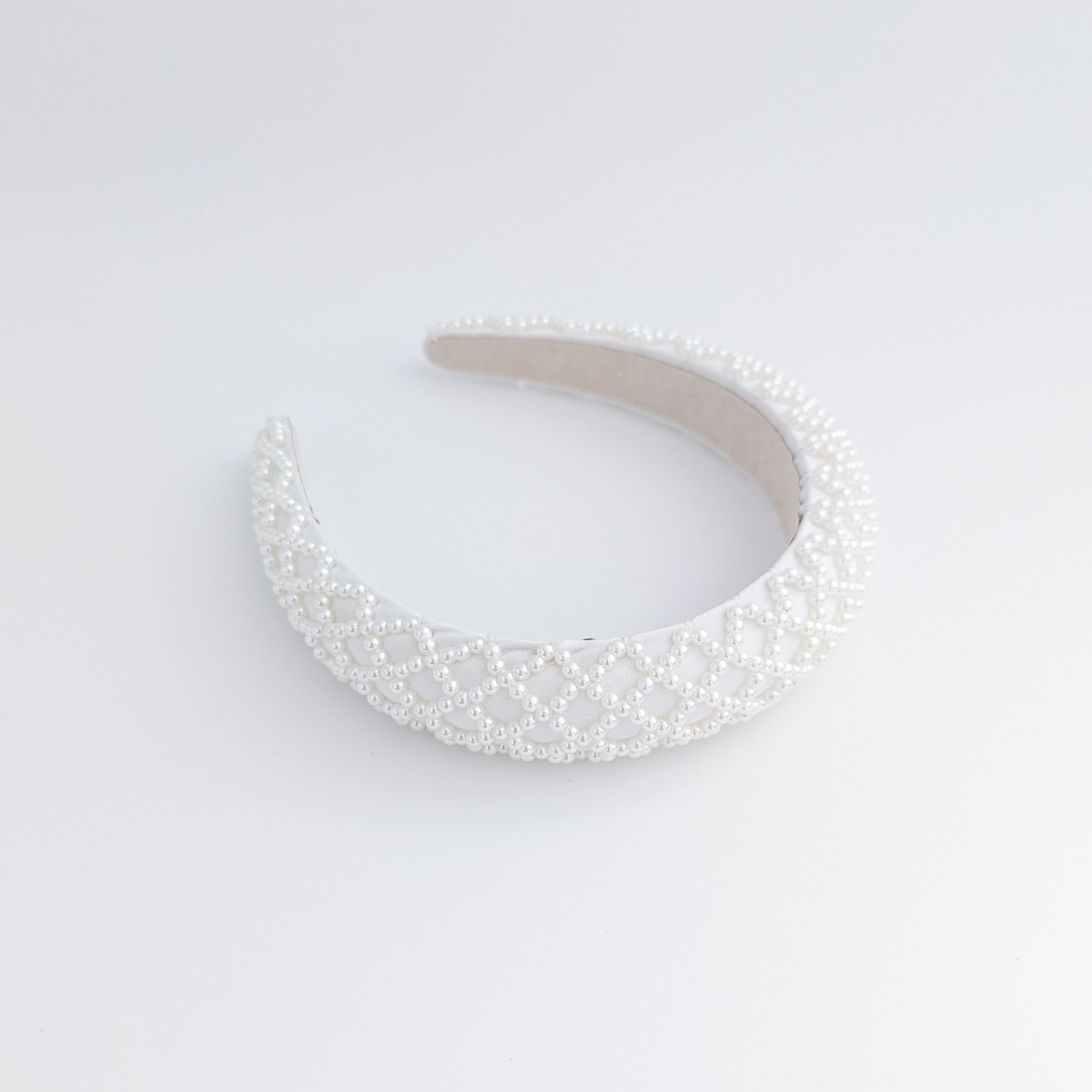 White beaded pearl padded headband fascinator White beaded pearl padded headband fascinator