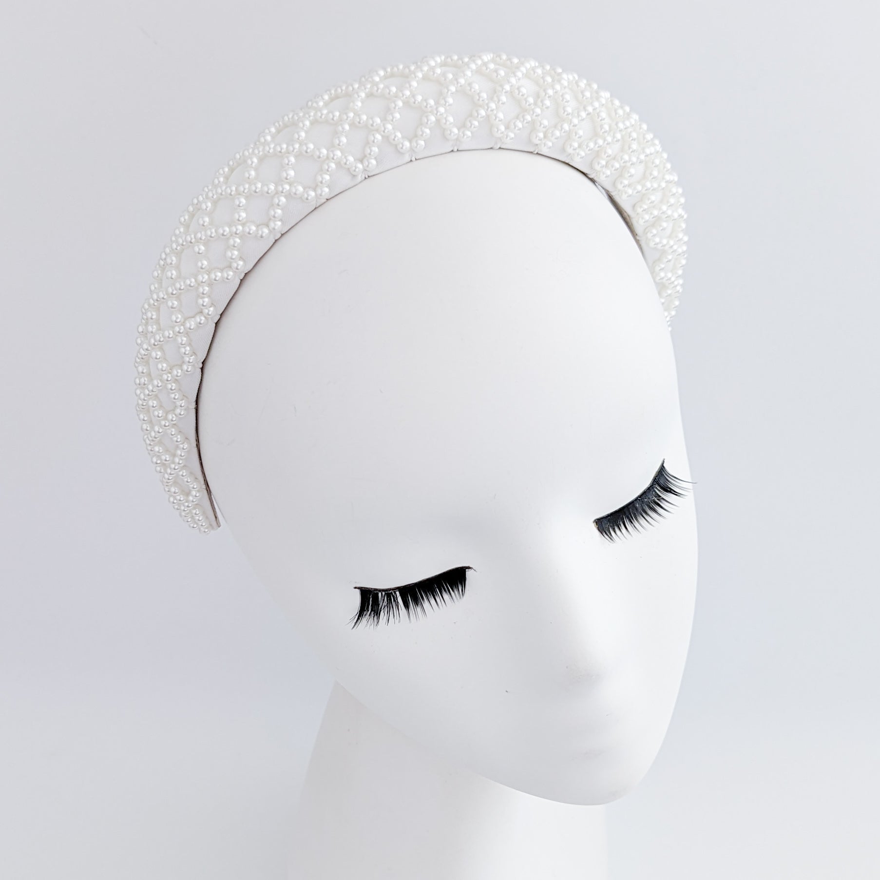 White beaded pearl padded headband fascinator White beaded pearl padded headband fascinator