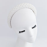 White beaded pearl padded headband fascinator White beaded pearl padded headband fascinator
