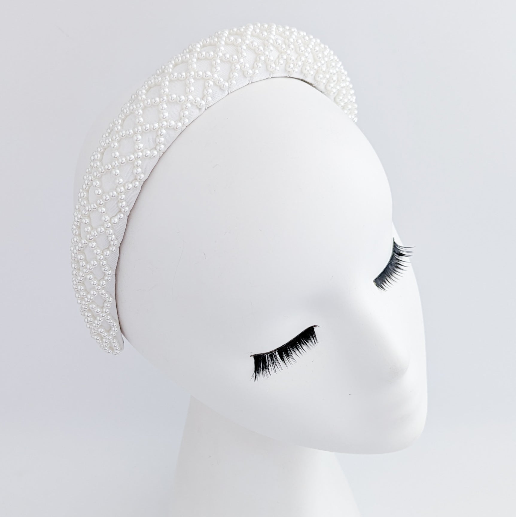 White beaded pearl padded headband fascinator White beaded pearl padded headband fascinator