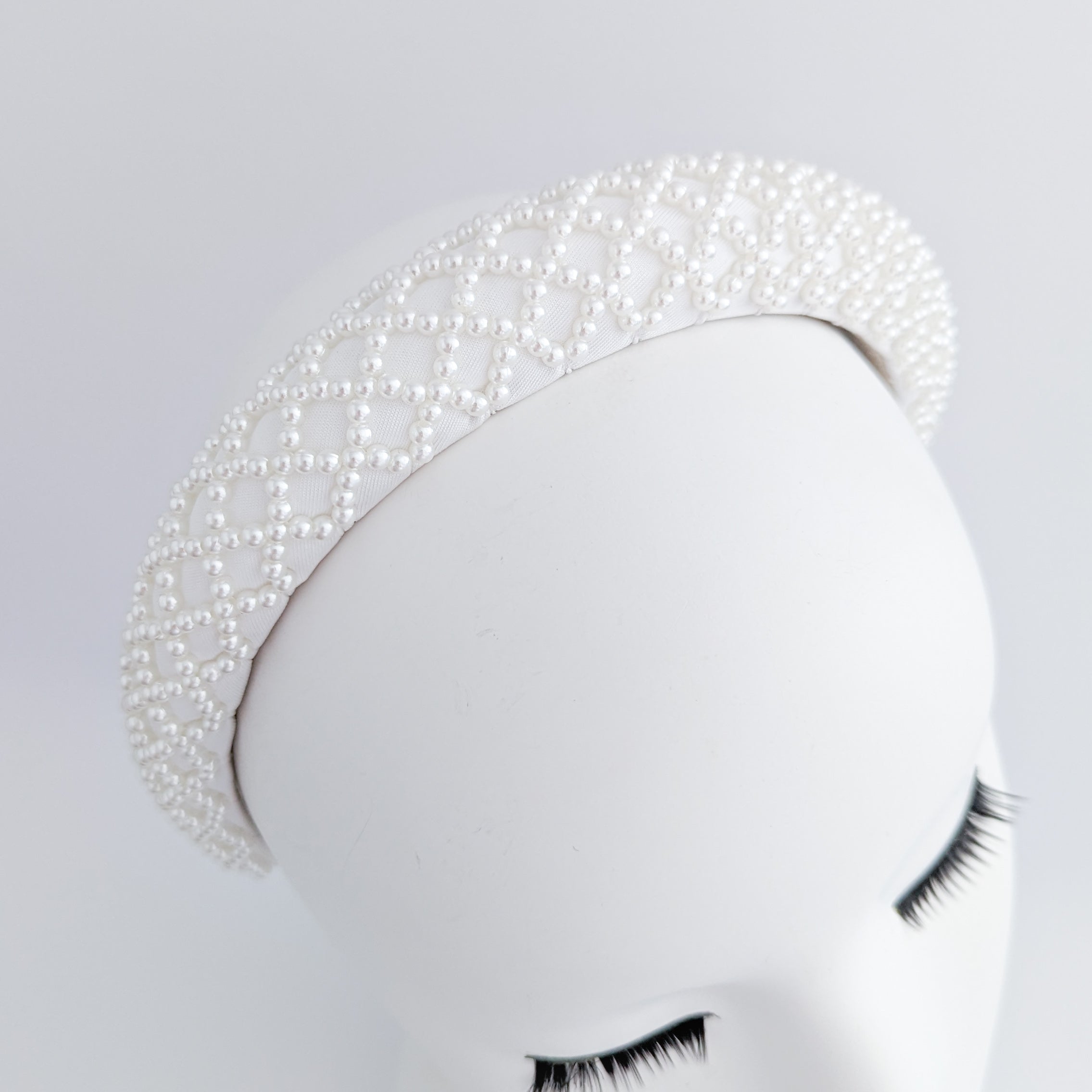 White beaded pearl padded headband fascinator White beaded pearl padded headband fascinator
