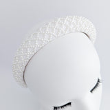 White beaded pearl padded headband fascinator White beaded pearl padded headband fascinator
