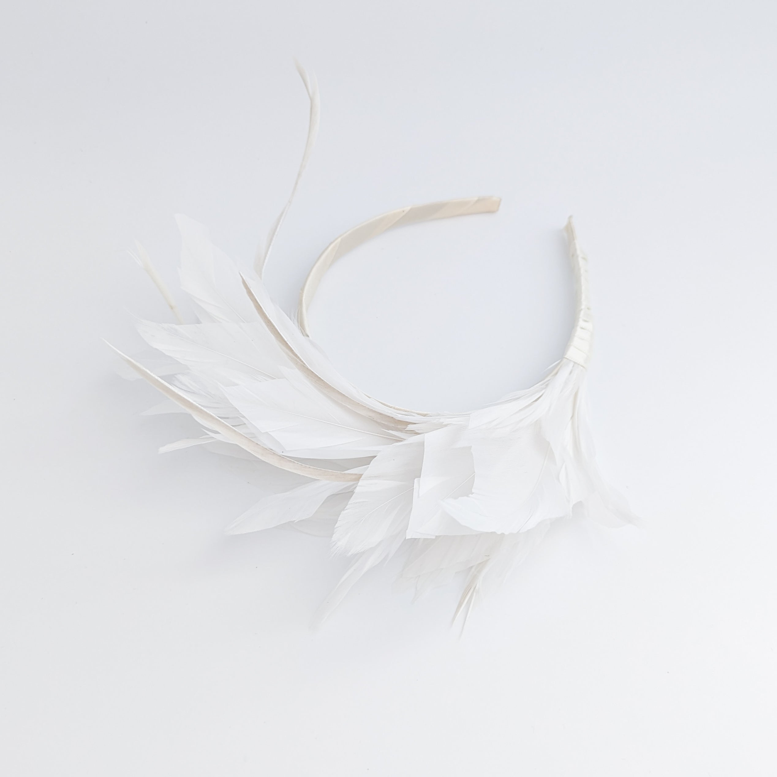 Off White feather satin headband fascinator Off White feather satin headband fascinator