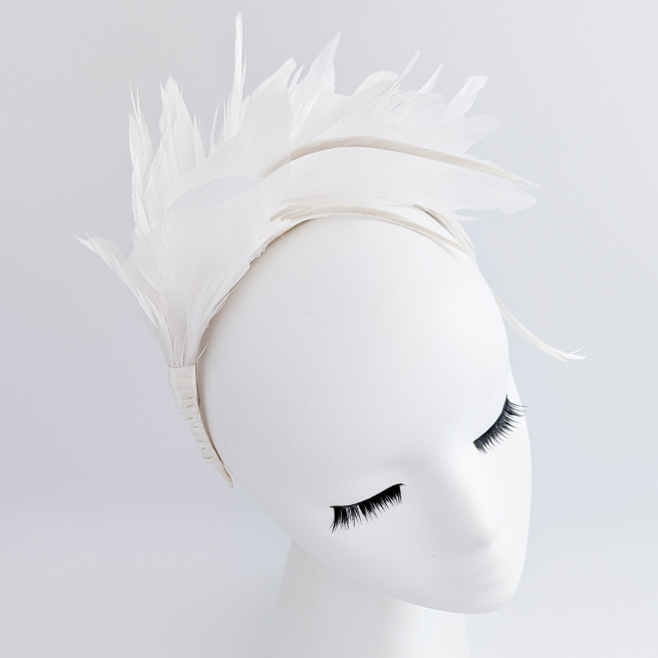 Off White feather satin headband fascinator Off White feather satin headband fascinator