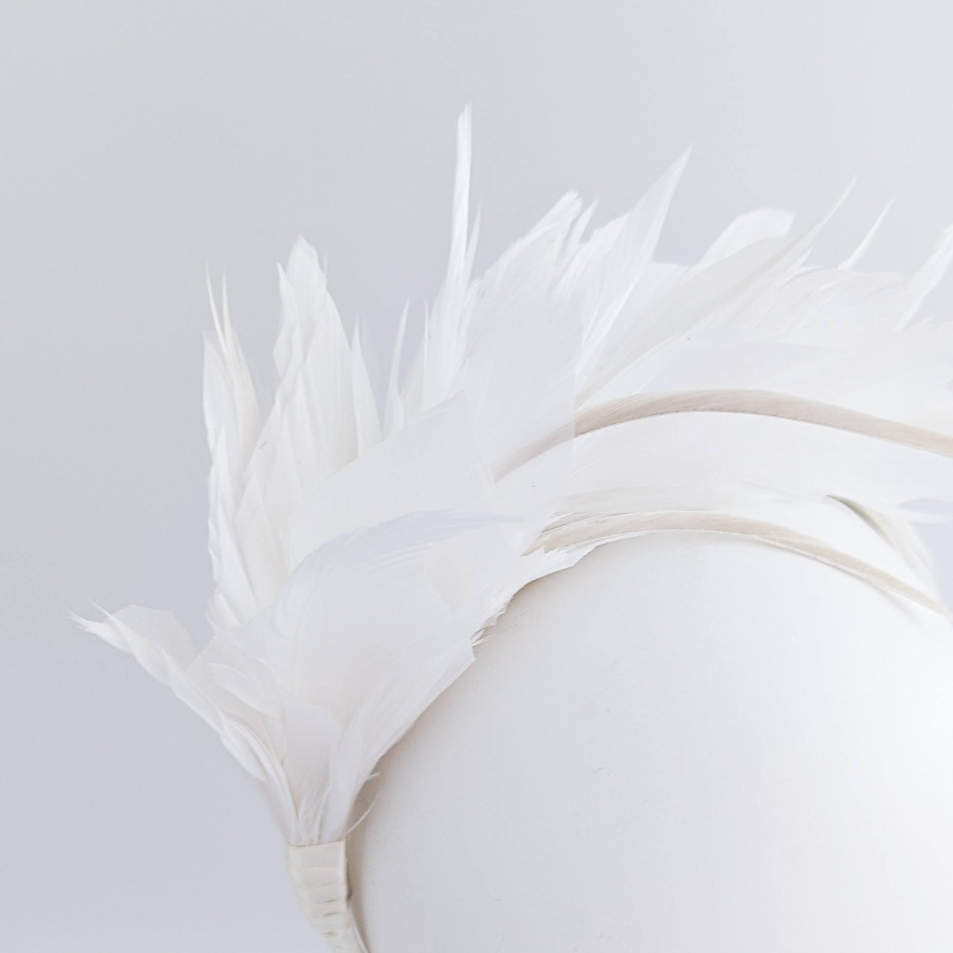 Off White feather satin headband fascinator Off White feather satin headband fascinator