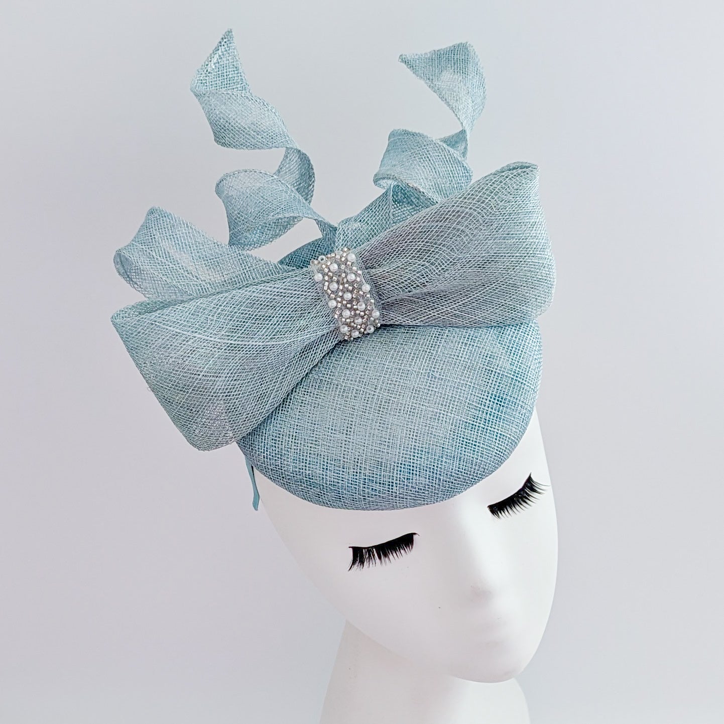 Aquamarine blue crystal bow fascinator hat Aquamarine blue crystal bow fascinator hat