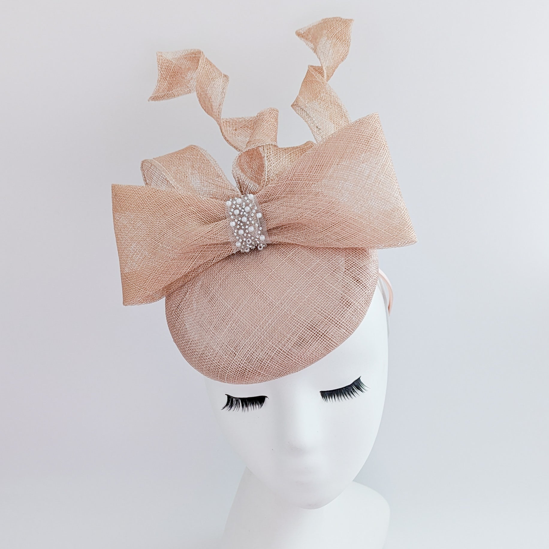 Light peach pink crystal bow fascinator hat Light peach pink crystal bow fascinator hat
