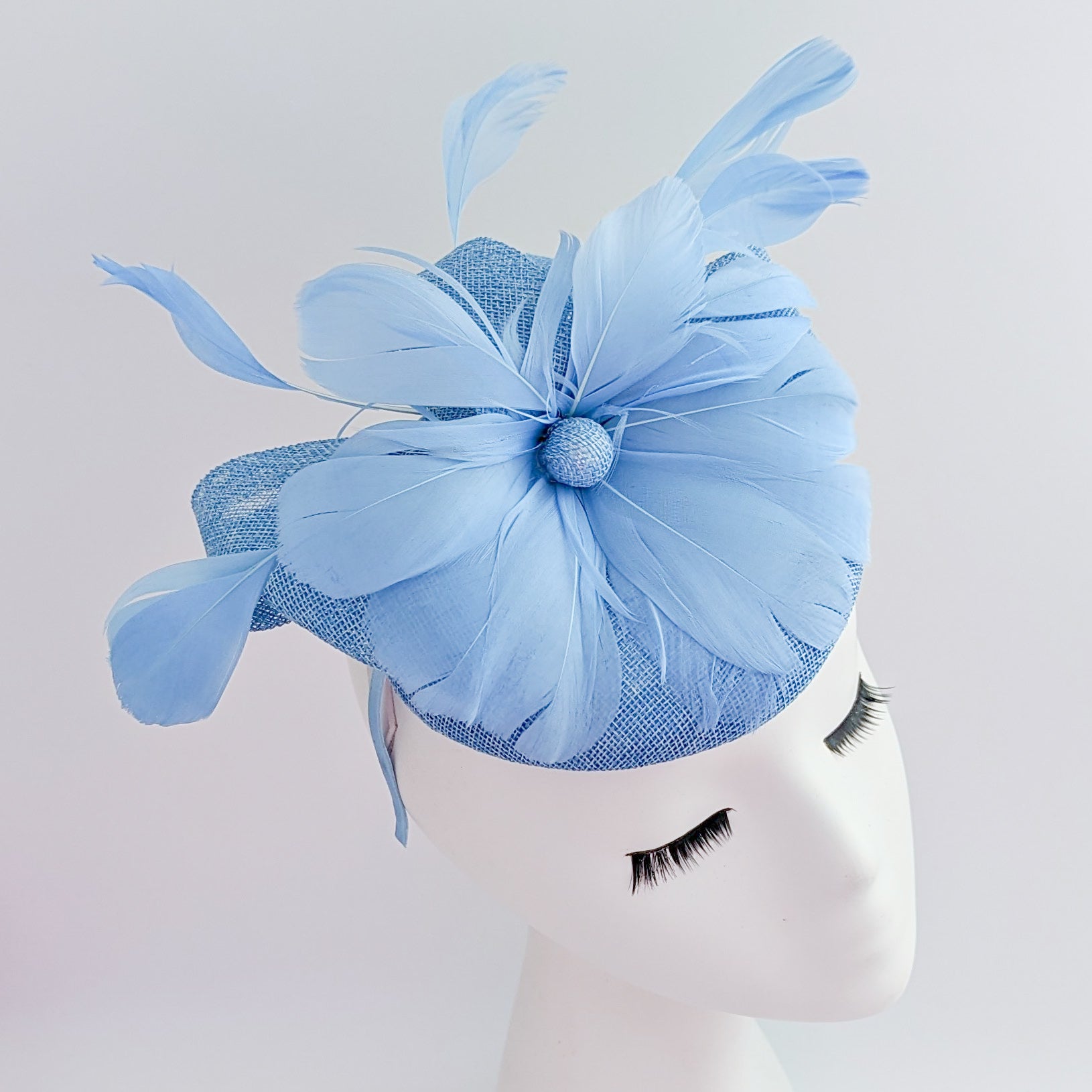 Light cornflower blue feather fascinator hat Light cornflower blue feather fascinator hat