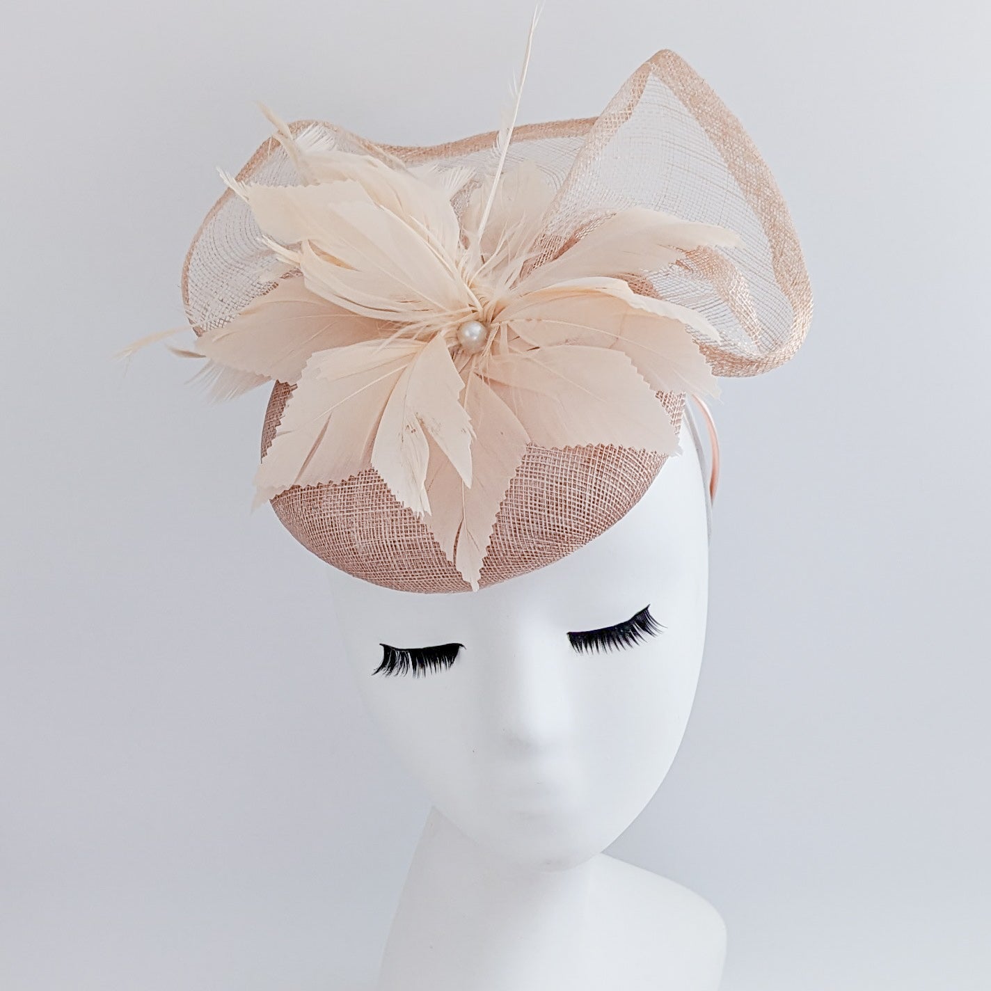 Light peach pink pearl feather fascinator hat Light peach pink pearl feather fascinator hat