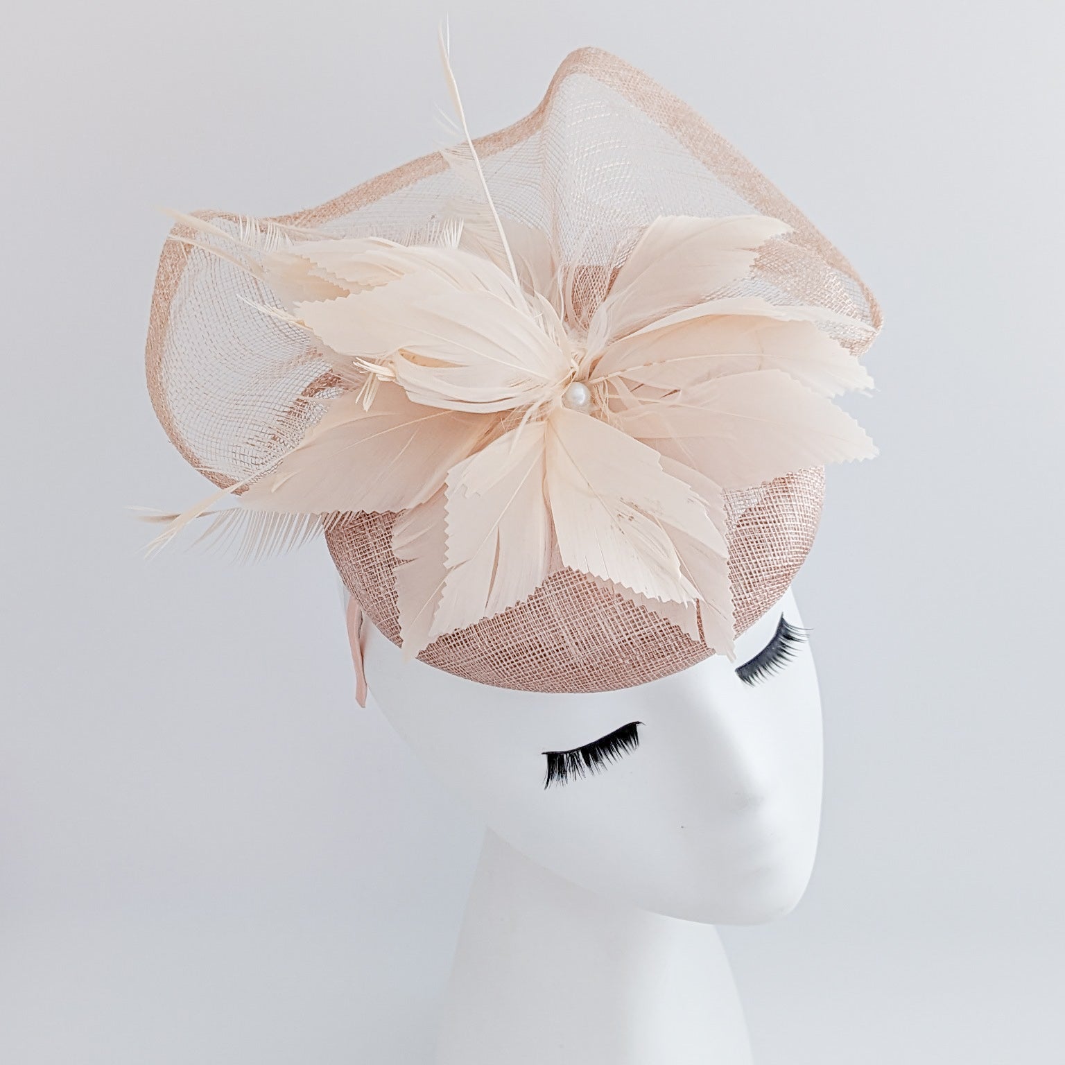 Light peach pink pearl feather fascinator hat Light peach pink pearl feather fascinator hat