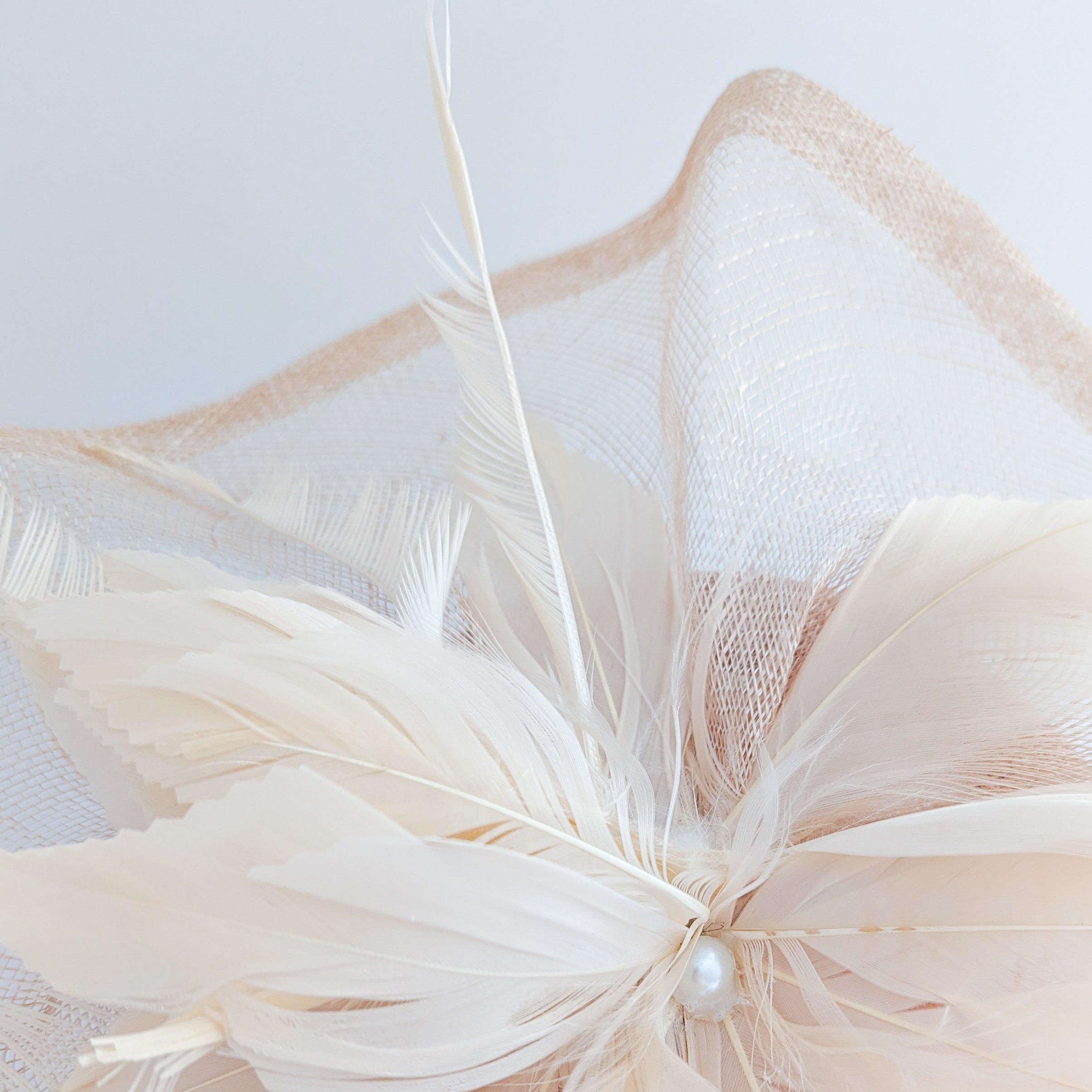 Light peach pink pearl feather fascinator hat Light peach pink pearl feather fascinator hat